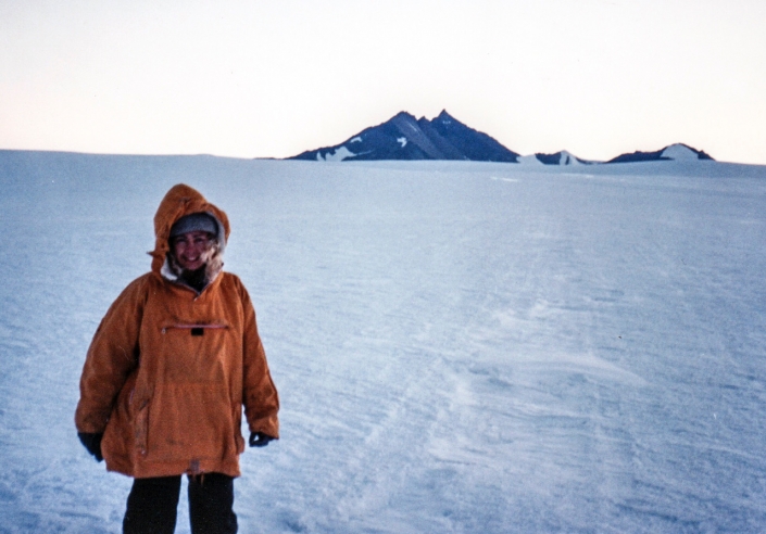 Stevie Davenport, author of “A Crack in the Ice” on the plateau inland from Mawson with Mt Henderson © Stevie Davenport