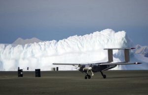 Windracers ULTRA UAV in front of ice cliffs at Rothera Research Station (Windracers & British Antarctic Survey)