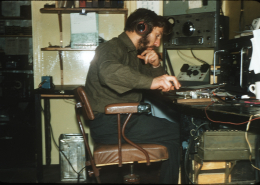 Roy at the Radio Office Mawson, April 1957